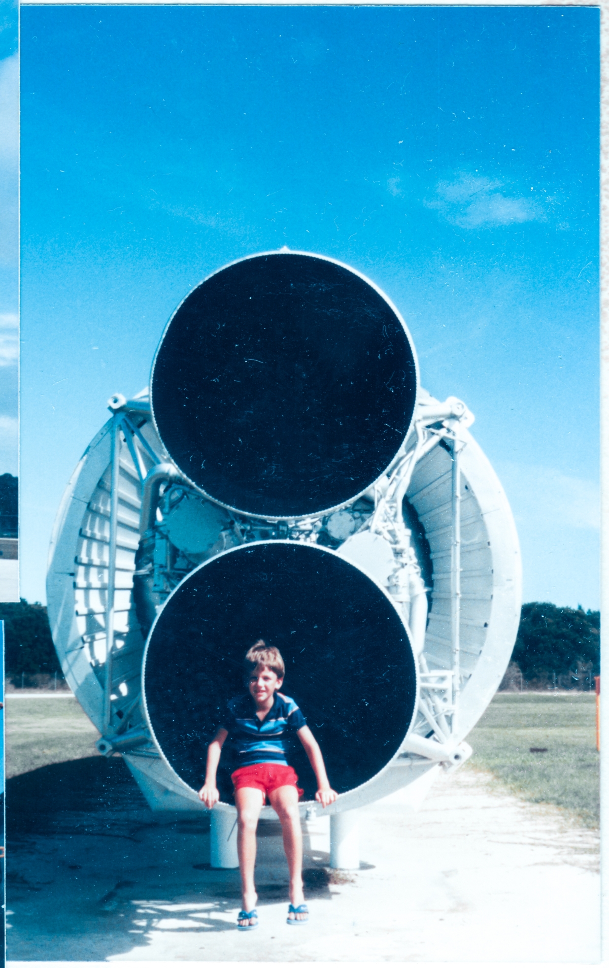 Oh the places you’ll go! Perhaps even inside of a rocket engine, one day you may go! And so it is. And so it was. And so Kai MacLaren, visiting the Air Force Space Museum on Cape Canaveral Air Force Station with his dad, finds himself ever-so-happily sitting inside of the nozzle of an Aerojet LR87-3 Lox/Kerosine engine which powers the first stage of the Titan I rocket, which was then on display, but is no more. Carpe diem Kai! And so it was done.